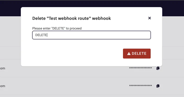 The second delete confirmation dialog in RC3, for the webhook named Test webhook route, over the dimmed Webhooks page. Under the prompt Please enter DELETE to proceed, the text field has DELETE typed in it, and a red Delete button with a warning triangle sits at the bottom right.